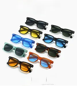 Detail of square sunglasses with golden arrow rivets and various colorful frames