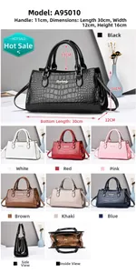 Detail view of crocodile pattern handbag with multi-layer interior and size dimensions