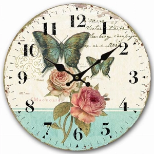 Detail of vintage wooden clock with butterfly rose print and French script decor