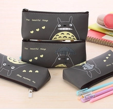 Macro view of dark gray Totoro canvas coin purse and pencil case with cute cartoon prints