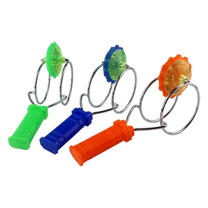 Three colorful magic rail twirler toys in green, blue, and orange with magnetic wheels