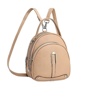 Minimalist beige lychee grain leather backpack with silver zippers in a side view display