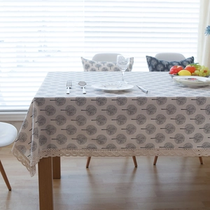 Linen style beige tablecloth with black tree print and delicate lace edge decoration