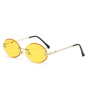 Rimless oval sunglasses with yellow transparent lenses and twisted gold metal frames