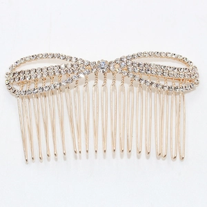 Peigne à cheveux doré avec un design de nœud étincelant orné de strass en cristal
