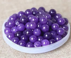 Macro shot of polished purple round beads for DIY jewelry and bracelet making