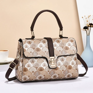 Elegant vintage crossbody handbag with brown fan pattern and leather strap in scene