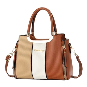 Three-tone textured leather handbag for women featuring top handles and crossbody strap