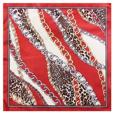 Detail of silk square scarf with gold chains and leopard print on red and cream background