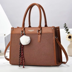 Brown patchwork tote bag with handles and detachable strap for daily commuting
