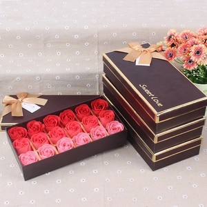 Close-up of 18 red and pink soap roses in a brown gift box with golden Sweet Love ribbon
