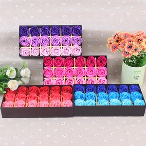 Top view of 18 rose-shaped soap flower gift boxes in purple, pink, red, and blue colors