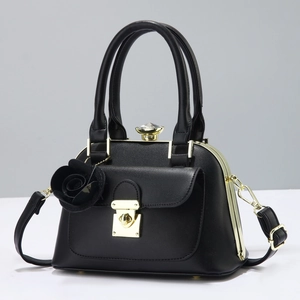Classic black leather handbag with gold lock and elegant 3D rose charm attachment
