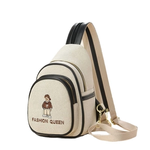 Minimalist cream canvas sling bag with cartoon embroidery and black leather trim accents