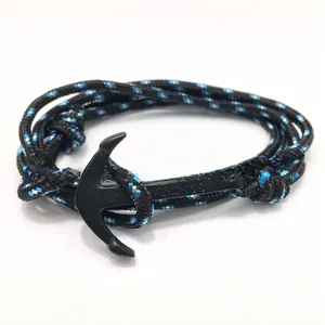 Detail of nautical rope bracelet with matte black anchor charm and Vikings engraving