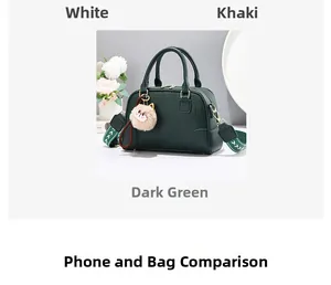 Detail of dark green pebble leather Boston bag with floral strap and cat charm