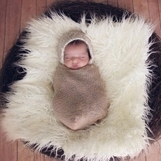 Newborn photography prop set with brown knitted swaddle wrap and matching baby hat