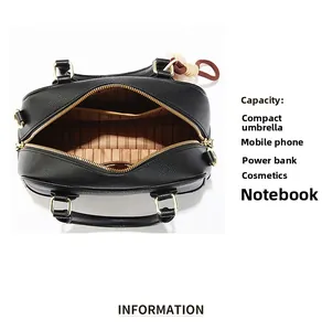Macro view of black litchi leather bag interior with brown lining and zipper pocket