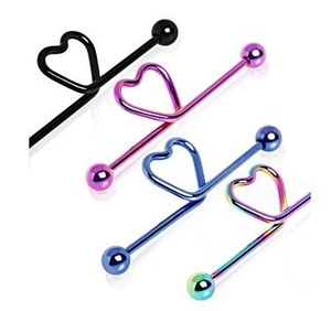 Close-up of heart-shaped industrial barbell earrings in diverse metallic finishes