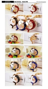 Detailed view of colorful carp keychains with enamel details and sparkling rhinestones