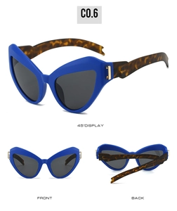 Détails de lunettes de cyclisme œil-de-chat avec monture bleu vif et branches écailles