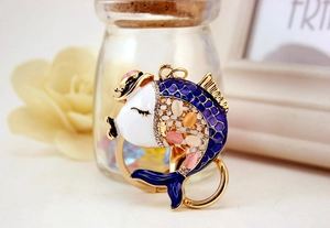 Close-up of koi fish keychain with blue enamel and sparkling rhinestones