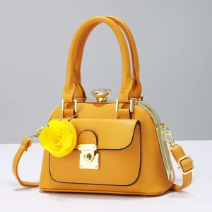 Elegant yellow leather handbag with gold hardware and yellow rose floral charm