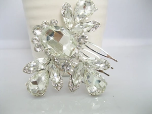 Detail view of silver bridal hair comb with clear faceted crystals and rhinestones