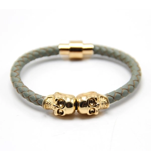 Men's punk leather bracelet with green braided band and golden skull magnetic clasp