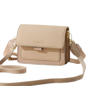 Elegant beige fabric crossbody bag with adjustable strap and flap closure for women
