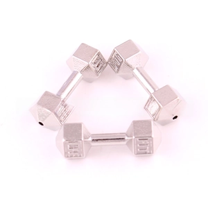 Detailed macro of three matte silver zinc alloy mini dumbbells with FIT engraving