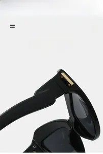 Détail des charnières en métal doré sur lunettes de cyclisme œil de chat noir léger