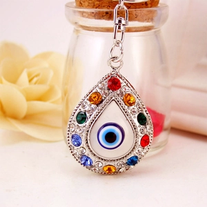 Silver evil eye keychain with colorful rhinestones and teardrop metal pendant