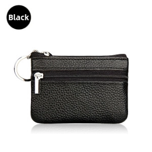 Detail of black pebbled leather wallet with double zippers and silver metal keychain ring