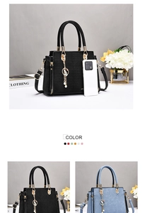 Close-up of crocodile pattern leather handbag with metal charm and tassel detail