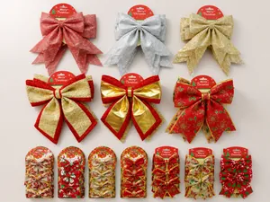 Macro detail of 25cm glitter Christmas bows in red, gold and silver for tree decoration