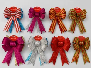 Detail view of 25cm glitter Christmas bows in various festive colors on a display wall