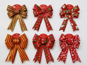 Detail showing various 25cm glitter Christmas bows with festive patterns for DIY decor