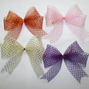 Detail of 25cm glitter mesh Christmas bows in red, gold, pink and silver set of four