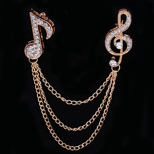 Rose gold musical note brooch set with sparkling crystals and elegant triple layer chains