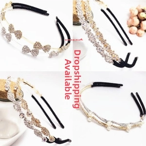 Detail of double-layer metal headband featuring zircon butterflies and white pearls