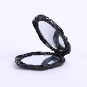 Black round folding makeup mirror with rose petal edge design and double-sided glass