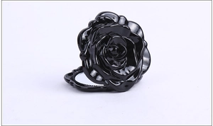 Detail view of a black 3D rose-shaped foldable makeup mirror with high-gloss finish
