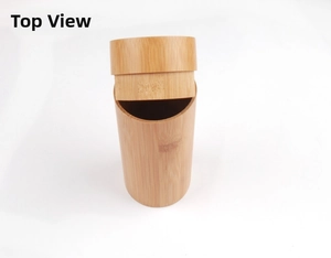 Detailed view of cylindrical bamboo case with semi-open lid showing natural wood grain