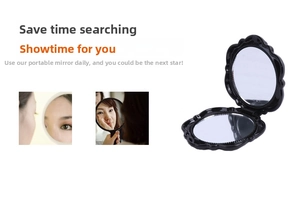 Close-up of black vintage folding pocket makeup mirror with relief floral pattern