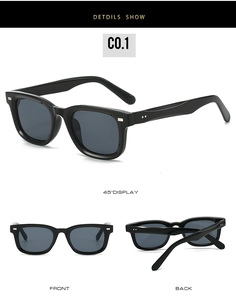 Detailansicht der quadratischen schwarzen Sonnenbrille mit Nieten und grauen Gläsern