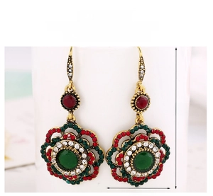 Macro shot of vintage floral drop earrings showing dimensions 56mm by 28mm