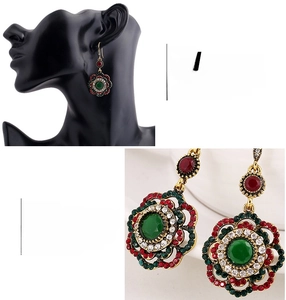 Macro shot of vintage bohemian flower drop earrings with colorful rhinestones in gold tone