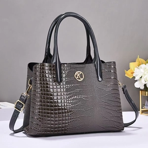 Gray crocodile pattern leather tote bag with gold K logo and adjustable shoulder strap