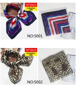 Close-up of 50x50cm silk-like square scarf featuring geometric stripes and leopard print